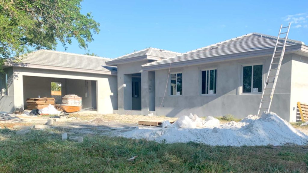 Stucco, roof tiles & windows installed