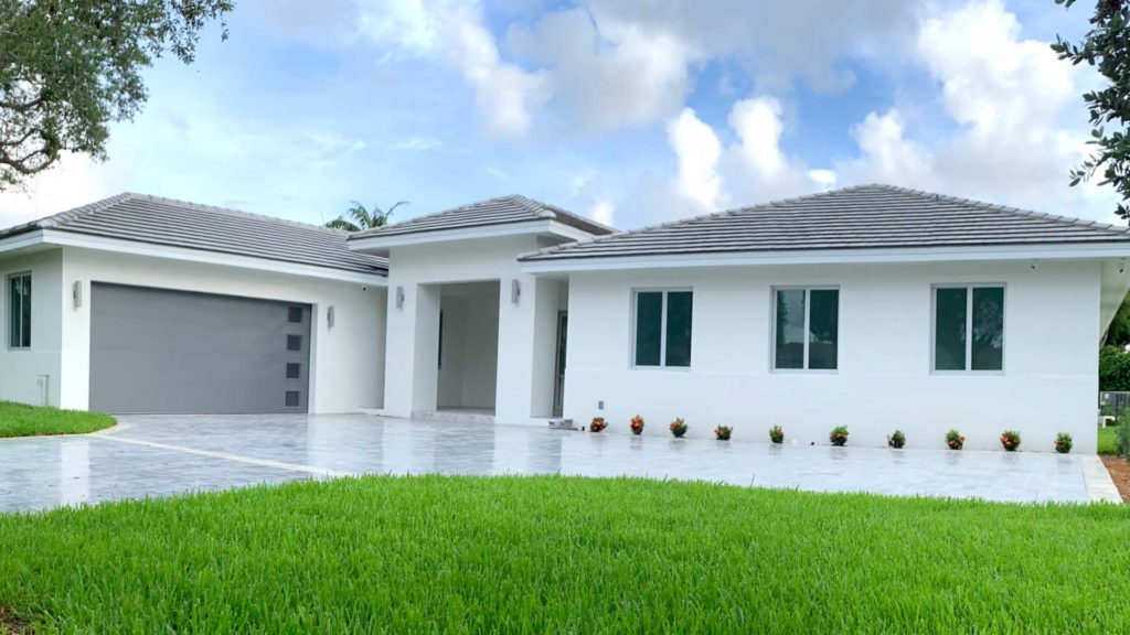 Completed driveway, garage door and sod installation