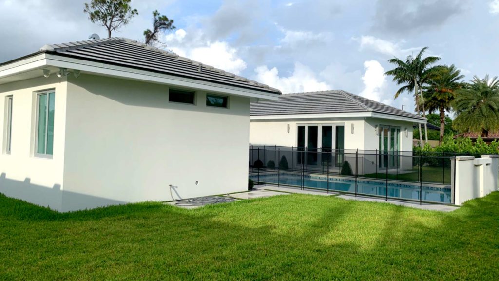 View of rear yard with installed sod and finished pool