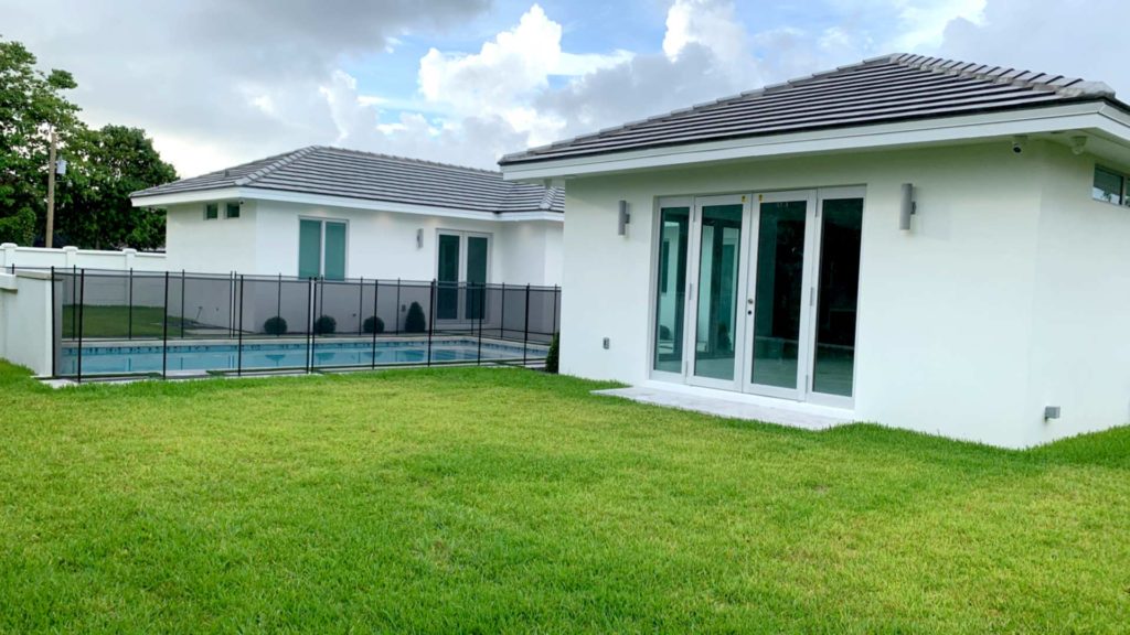 Rear east view of pool and family room doors